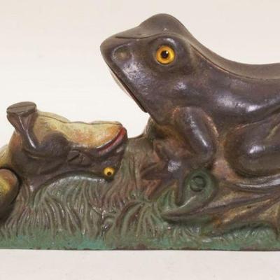 1092	ANTIQUE CAST IRON MECHANICAL BANK , FROG, FROG HAS GLASS EYES, APPROXIMATELY 9 IN X 3 IN X 4 1/2 IN H
