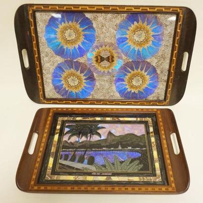 1016	2 INLAID SERVING TRAYS, 1 WITH REVERSE PAINTING AND BUTTERFLY WING TRAY, BOTH WITH LILAID BORDER, LARGEST APPROXIMATELY 15 IN X 25 IN
