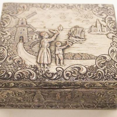 1068	ORNATE SILVER PLATE DRESSER BOX DEPICTING A DUTCH SCENE WITH WIND MILL, APPROXIMATELY 3 IN X 4 IN X 2 IN H
