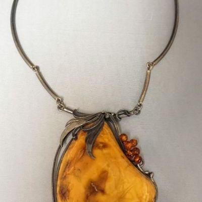 1238	ORANGE TURQUOISE STONE NECKLACE WITH ORANGE STONES, NECKLACE APPROXIMATELY 12 IN L, STONE APPROXIMATELY 3 1/2 IN X 2 3/4 IN W
