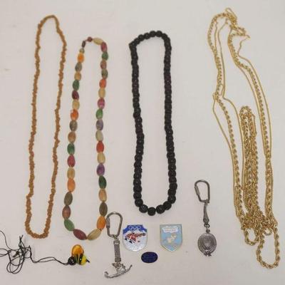1232	ASSORTED NECKLACES INCLUDING MONET TRIPLE STAND CHAIN, MYRRH BEAD NECKLACE, PINS, AND KEY CHAINS
