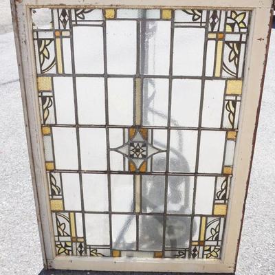 1040	STAIN GLASS WINDOW WITH LOSS TO SOME PANELS, APPROXIMATELY 35 1/2 IN X 48 IN OVERALL
