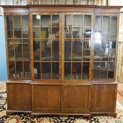 1178	ANTIQUE GEORGIAN MAHOGANY BREAKFRONT 2 PART W/INDIVIDUAL PANE GLASS DOORS, SOME VENEER LOSS, APPROXIMATELY 17 IN X 90 IN X 85 1/2 IN
