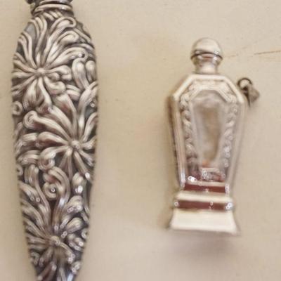 1057	2 VICTORIAN STERLING SILVER PERFUMES, TALLEST APPROXIMATELY 3 1/2 IN
