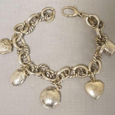 1245	STEERLING SILVER CHARM BRACELET WITH LOCKETS, APPROXIMATELY 8 IN LONG, MARKED FINOZA. 1.5 TOZ
