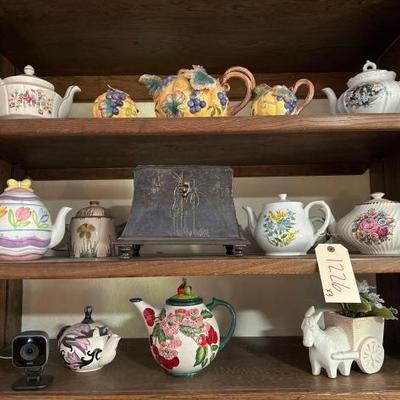 #1226 â€¢ Three Shelves of Teapots and Small Chest
