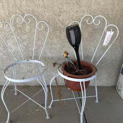 #10016 â€¢ two metal chairs, gardening pot
