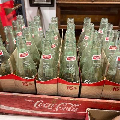 Coca-Cola bottles and crate