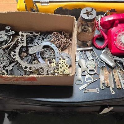 #2178 â€¢ Box of Cast Iron Trivets, (1) Red Rotary Phone, (1) Jar Lantern & More
