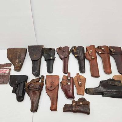 #1754 • (15) Leather Pistol Holsters & (1) Shotgun Sling
