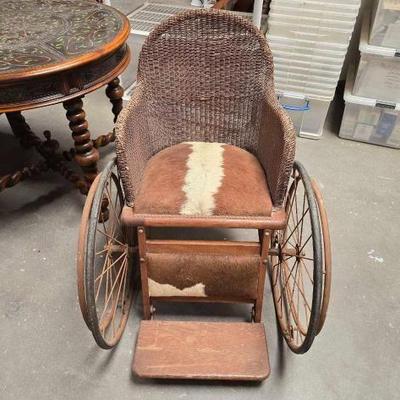 #2082 â€¢ Antique Cowhide Wheel Chair
