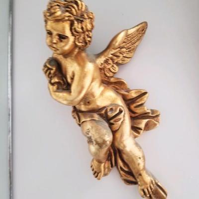 One of a set of two golden cherubs
