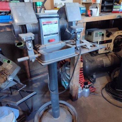 Bench Grinder on steel stand; 3/4 horse with stone wheel and wire brush.
