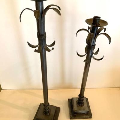 Metal candlesticks, 29 and 25 inches