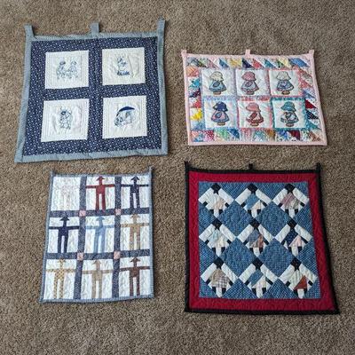 Four Quilted Wall Hangings