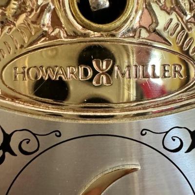 Howard Miller Grandfather clock with curio shelves $395