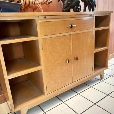 Vintage MCM credenza - 6 shelves, 1 wide drawer, 1 pullout shelf, 6 shelves. Back is finished, can be used in middle of the room.