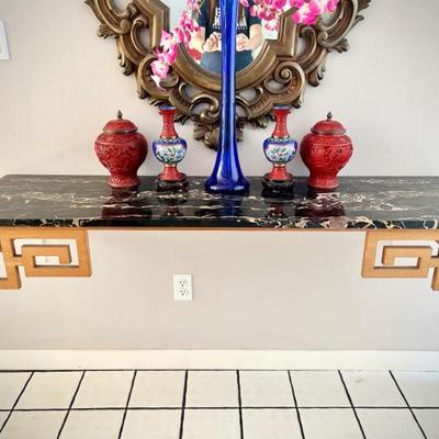 Black marble wall-mounted entry table with gold Asian detail (buyer must bring tools to remove)