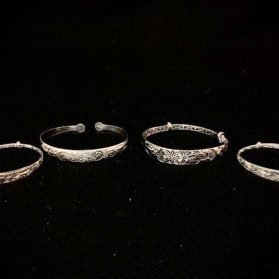 HAYE122 Four Chinese Sterling Bracelets	Two ladies and two children's bracelets. Three have intricate interior patterns and slide...