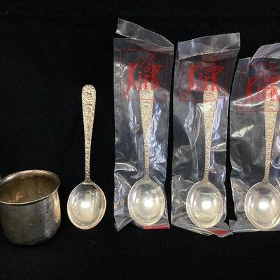 DALI706 Sterling Silver Spoons And Cup	An assortment of sterling silver. Includes 4 S. Kirk & Son Sterling silver spoons, 3 of which are...