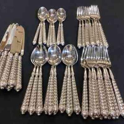 DILA109 Ricco Argentieri Spiral Flatware Set	There are 9 pieces of each set, except for the small spoon, which only has 8 pieces.Â 

