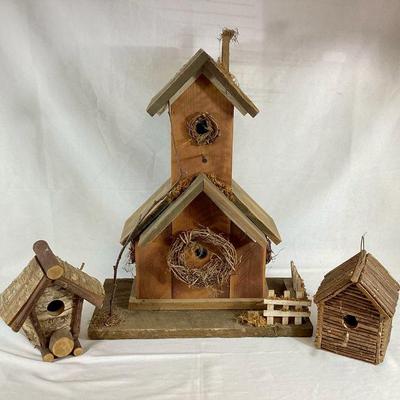 DILA704 Rustic Log Birdhouse Trio	A collection of three rustic bird houses. Includes a large birdhouse, and two smaller bird houses.Â 
