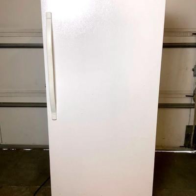 DILA209 Kenmore Standing Freezer	Tall upright freezer, has 5 shelves on the inside door. 
