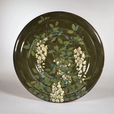 ROZENBURG DEN HAAG CHARGER | C. 1895 With green glaze, signed on the bottom and numbered 328 - dia. 15.25 in.

