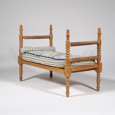ANTIQUE WOOD DOLL BED | Having turned wood posts and down mattress and pillow - l. 17 x w. 9 x h. 13 in.
