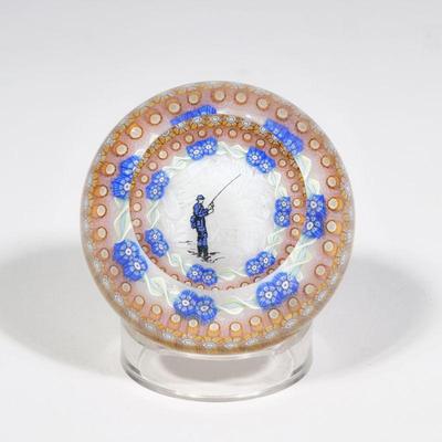 PERTHSHIRE ART GLASS FISHERMAN PAPERWEIGHT | Showing a fisherman before a white patterned background in a circle of millefieure...