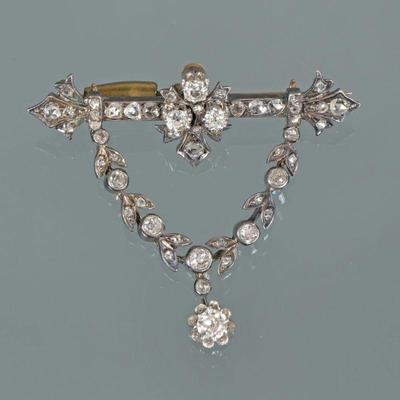 ANTIQUE LAUREL GARLAND BROOCH | 19th century, antique full cut and rose cut diamonds, designed as a bar-form pin mounting 27 diamonds...