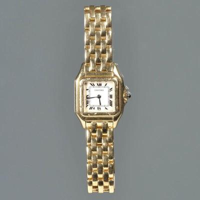 A LADIES PANTHERE DE CARTIER 18K GOLD WRISTWATCH | White dial with Roman numerals, stylized rectangular border, sapphire crown, on a...