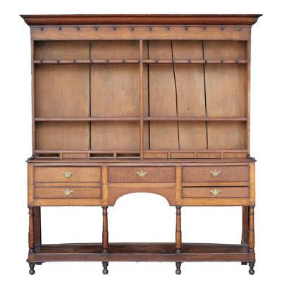 18TH/19TH CENTURY WELSH DRESSER | Three plate racks with two rows of cup hooks over a lower row of 8 small drawers; the lower section...