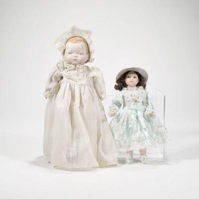 (2pc) PAIR ANTIQUE CERAMIC DOLLS | Includes: baby doll with ceramic head hands and feet, and small ceramic child in blue dress - l. 5.5 x...