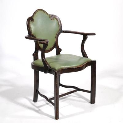 TRANSITIONAL ART NOUVEAU CARVED ARMCHAIR | Having a riveted leather back with ornate carved scrolls and curved hand-holds; leather...