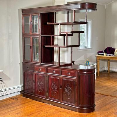 CHINESE LIGHTED DISPLAY CABINET | Having one section of glazed cabinet doors and a tiered carved wood open display with glass shelves...