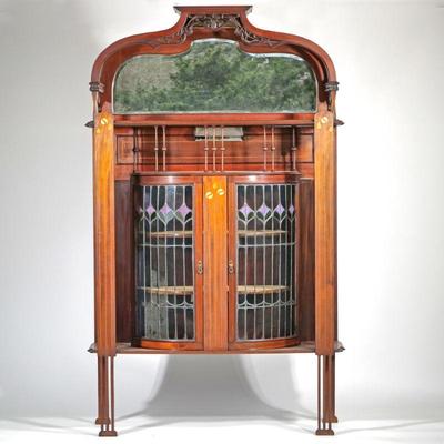 ENGLISH ART NOUVEAU SHOWCASE DISPLAY CABINET | English, late 19th/ early 20th century, manner of Shapland and Petter, leaded glass and...