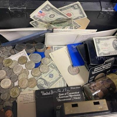 Coin and Currency lot.  Contents $5 dollar silver certificates, $2 dollar bills, commemorative coins , wheat pennies and more. STRONG BOX...