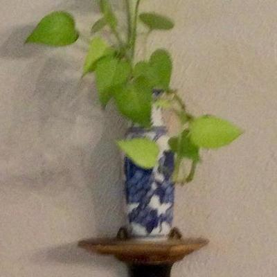 Blue and white vase on wall sconce