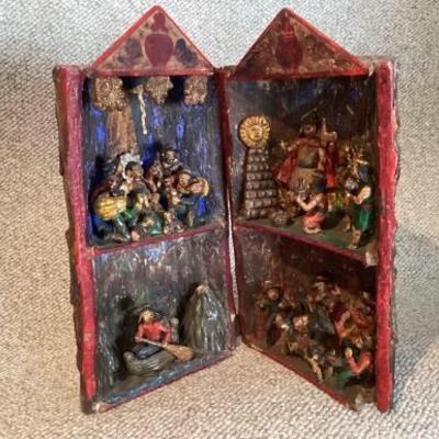 Carved nativity scene in log case