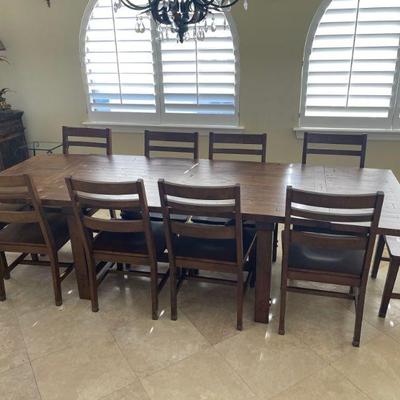 This dining room table seats 10, and is less than a year old. 