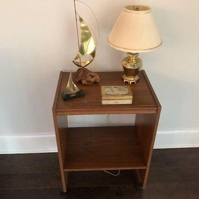 Wood lightweight TV stand $5; Wood map box small $2; Small Gold bedside lamp $10; Large sailboat $3; Small sailboat (heavy paperweight) $3