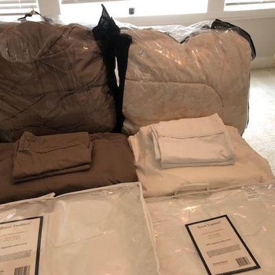 Queen size plush comforters $25 each; Queen size sheet sets $4 each;  Down filled pillows $2 each