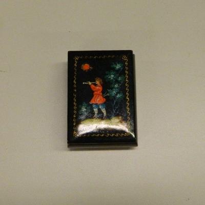 Russian lacquer box with boy playing trumpet signed
