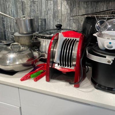 Small kitchen appliances including Hamilton Beach Crockpot, Gourmia Air Fryer, Fry Daddy, Muni Tortilla Toaster