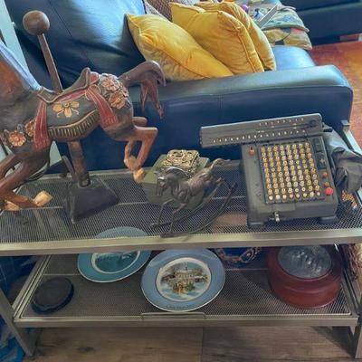 Decoratives everywhere, from wooden horses, electric antique adding machine and more