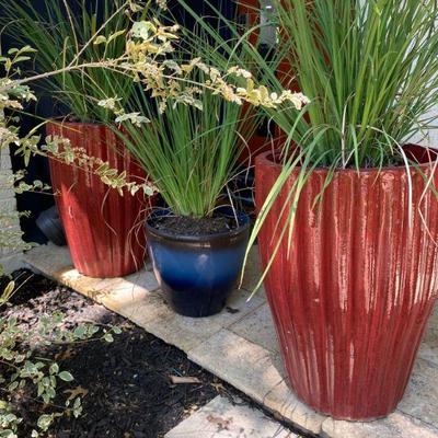 Beautiful Planters in the front yard, red, blue, green