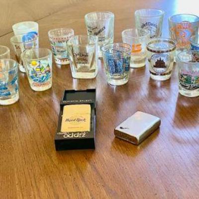 Lot 044-LR: Shot Glasses & Zippo Lighters

Features: 
â€¢	28 various commemorative shot glasses
â€¢	2 Zippo lighters

Dimensions: N/A...