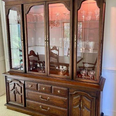 Lot 003-DR: MC Lighted China Cabinet Vignette

Features: 
â€¢	Two-piece mid-century China display cabinet with lights
â€¢	Glassware and...