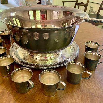 Lot 049-LR: Webster Wilcox Silver Plate Punchbowl & Cups

Features: 
â€¢	Punch bowl and ladle, platter, and 10 cups

Condition: Good...